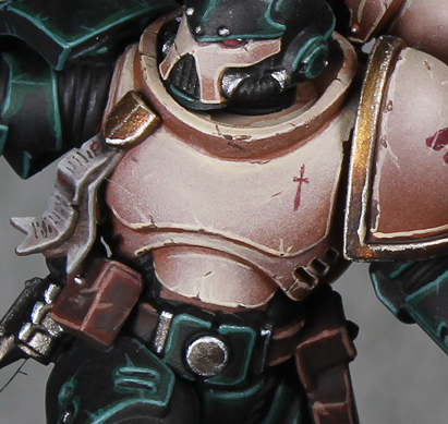 Close view of pale bone chest armor with warm brown shadows, fine light edges, and small surface scratches